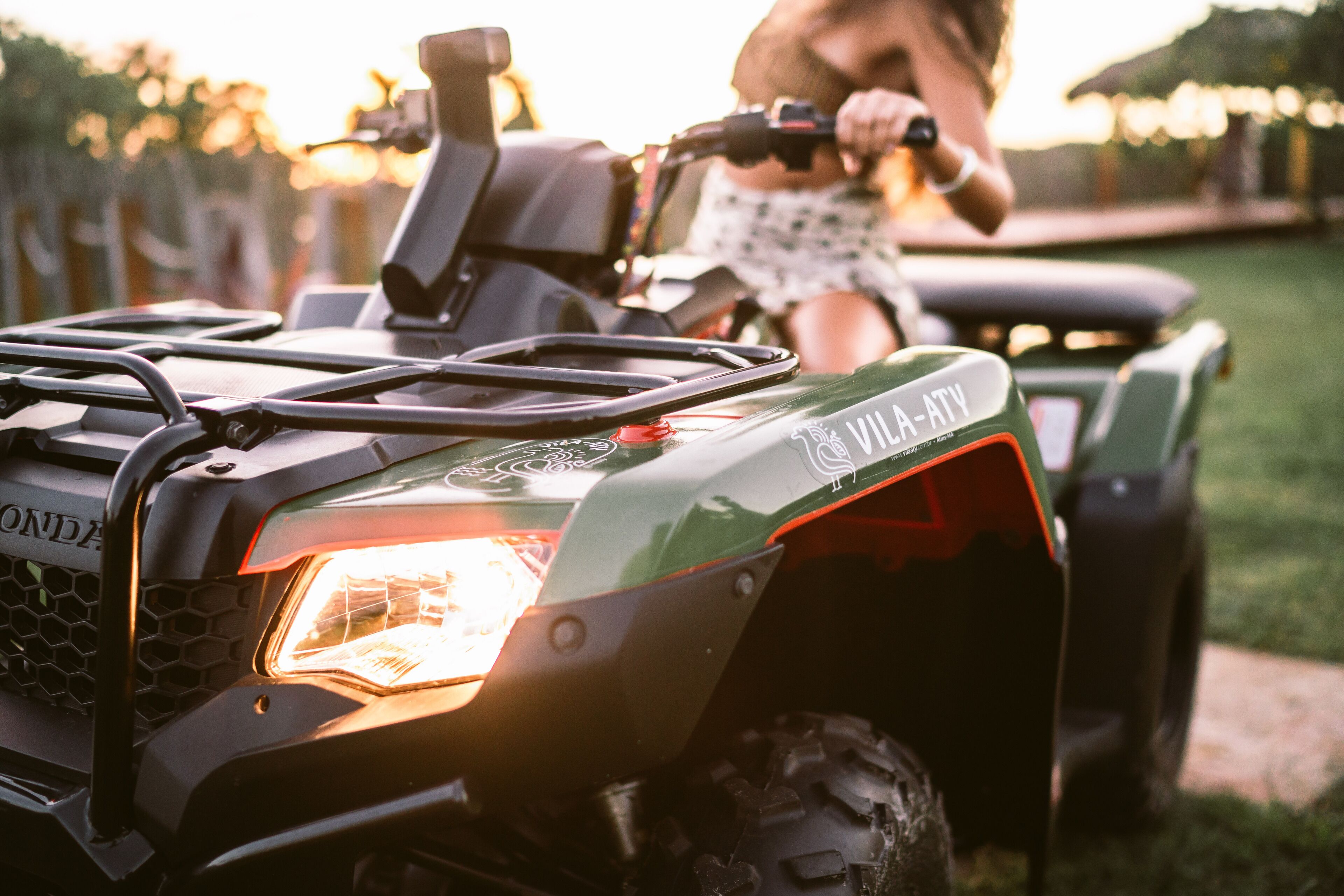 A close-up of a green utility vehicle with the text "VILLA-ATY" on the side.
