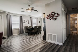 Enjoy meals in this cozy dining area with a table and chairs.