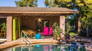 A swimming pool with a covered patio area, outdoor seating, and potted plants. - POOL OASIS! Super Reviews! EV Charger/1BR King/Wash/Dryer/Kitchenette/Sleeps 4 (Gilbert)