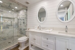 Combined shower/tub, hair dryer, towels, toilet paper