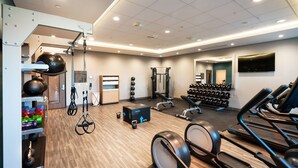 A gym with treadmills, weights, and exercise equipment. - Hampton Inn Riverside March Air Force Base (March Air Reserve Base)