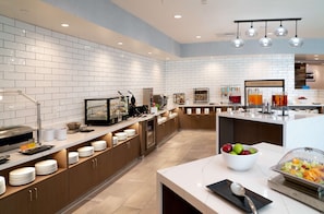 Enjoy a convenient kitchen area with a coffee machine, toaster, and microwave, perfect for preparing a quick breakfast.