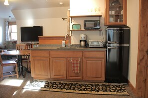 Fridge, microwave, stovetop, coffee/tea maker