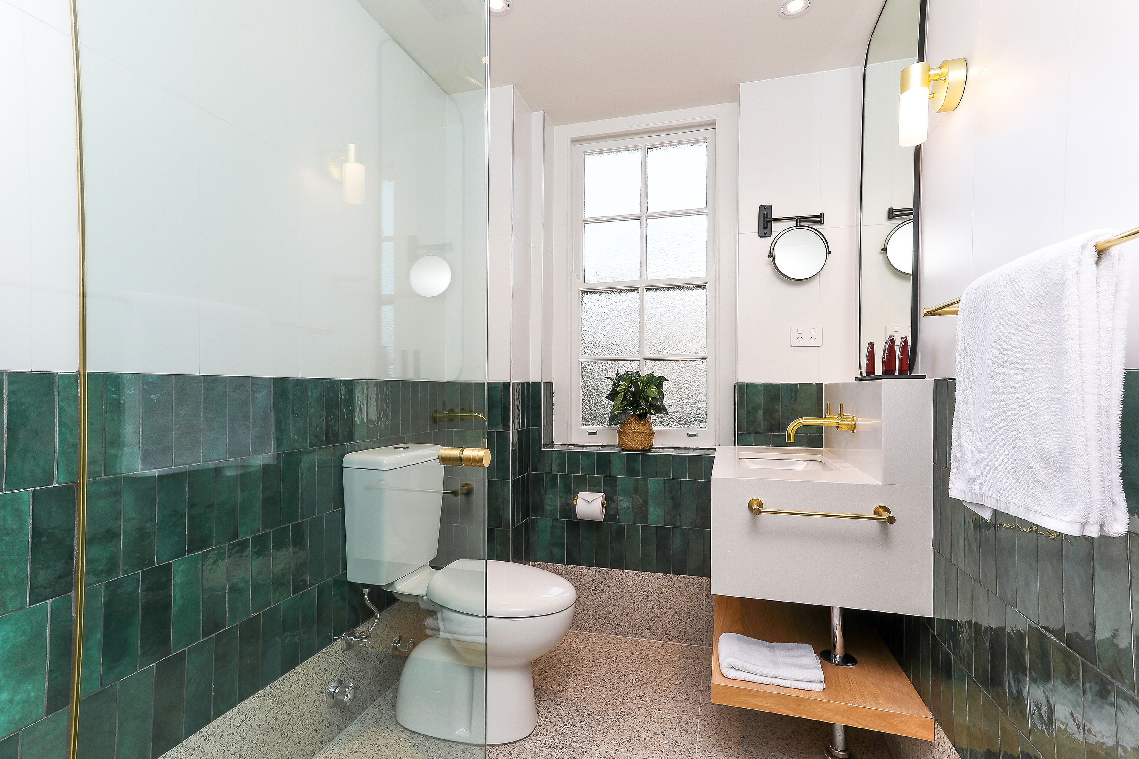 shower, rainfall showerhead, hair dryer, towels