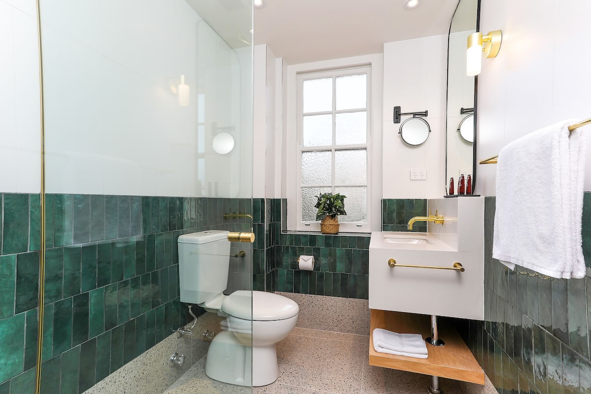 shower, rainfall showerhead, hair dryer, towels