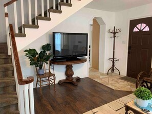 A staircase with wooden steps and a white railing. - Jailer`s Cottage | 130-Year-Old Gem | Sleeps 12 (Spring City)