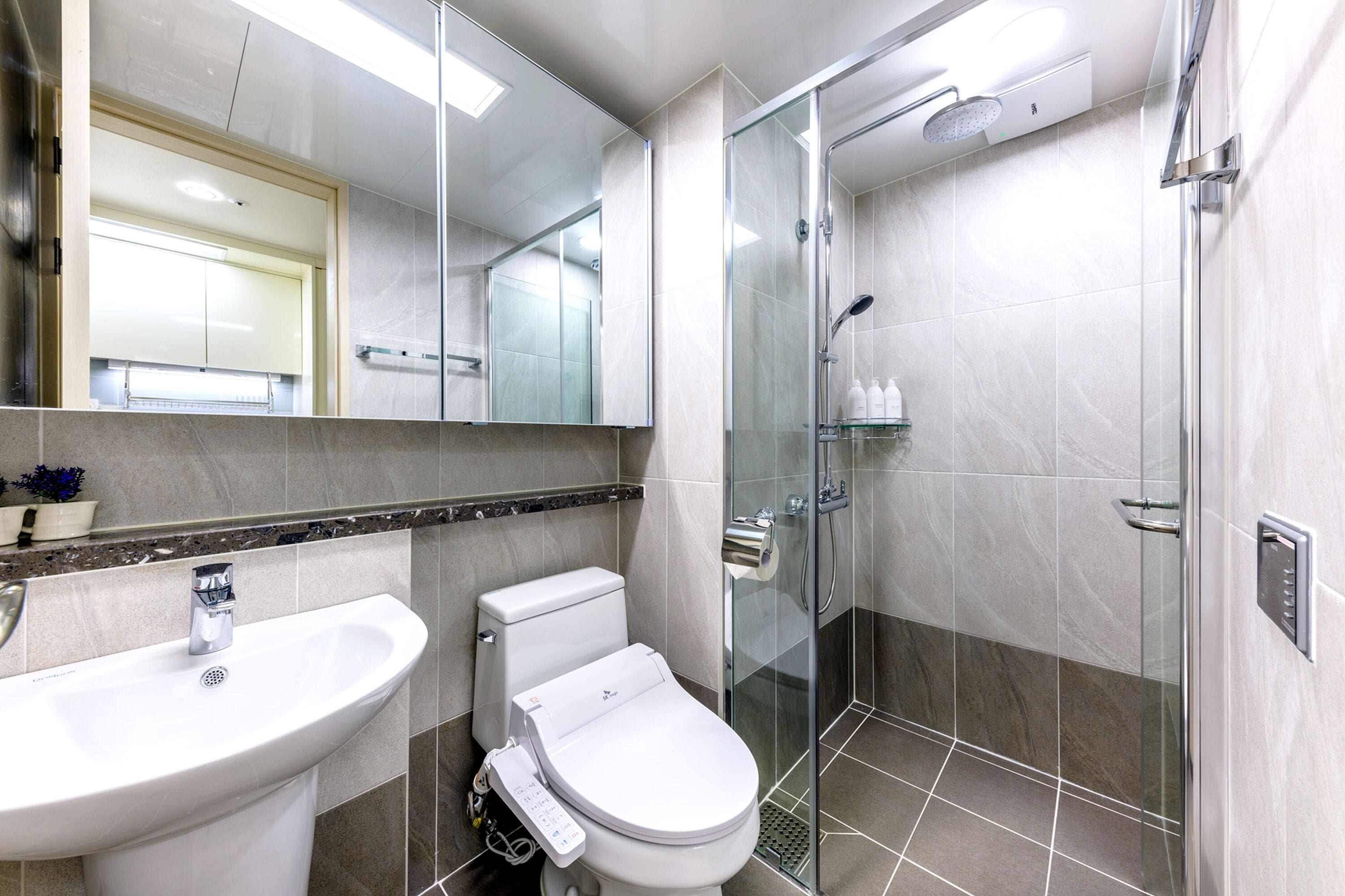 shower, hair dryer, slippers, bidet