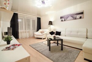 Standard Apartment | Living room | 36-inch TV with cable channels