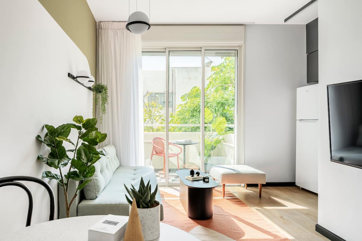 Apartment, 1 Bedroom, Balcony | Living area | 42-inch Smart TV with cable channels, TV