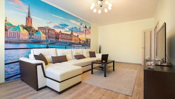 Comfort Apartment | Living room | 40-inch TV with cable channels