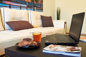 Comfort Apartment | Living area | 40-inch TV with cable channels