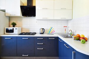 Comfort Apartment | Private kitchen | Full-size fridge, microwave, stovetop, electric kettle