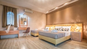 A hotel room with a large bed, a desk, a chair, and a vanity with a mirror. - Private pool villa with water massage pool and sea view roof garden (zakynthos)