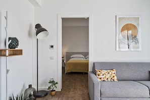 City Apartment | Living area | 32-inch flat-screen TV with digital channels, TV - Deluxe Apartments by Wonderful Italy (Genoa)