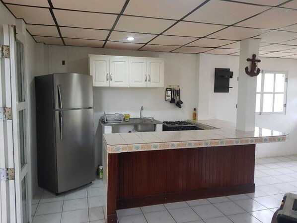 Fridge, oven, electric kettle, cookware/dishes/utensils