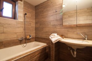 Combined shower/tub, hair dryer, towels, soap