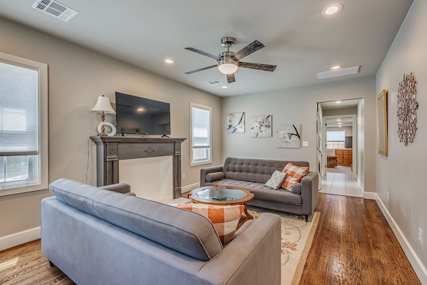 Inviting living room with ample seating and smart TV