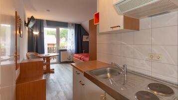 Fridge, microwave, stovetop, coffee/tea maker