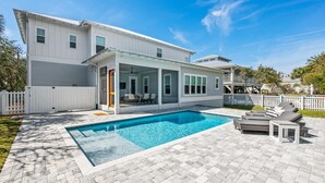 A modern two-story house with a swimming pool, outdoor seating, and a fenced backyard. - Close to the Town Square w/ Pool and LSV (Seacrest Beach)