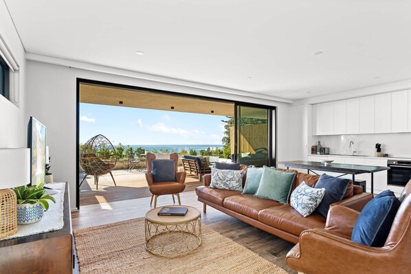TV, offices - Ocean Views, Deck and Parking at Beach Apartment (Collaroy)