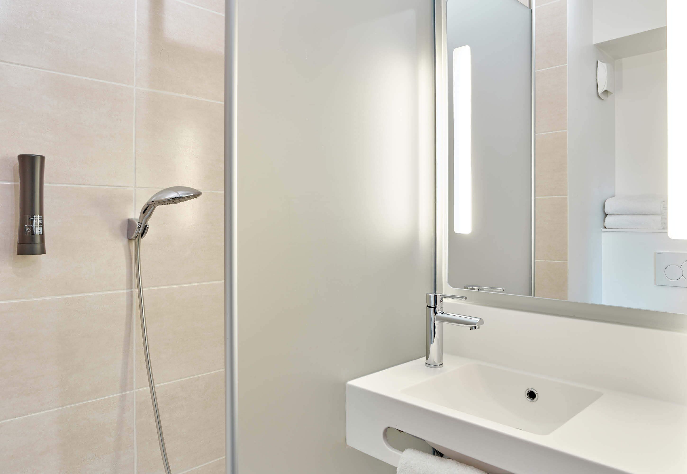 shower, towels, soap, toilet paper