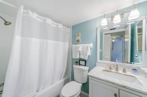 Combined shower/bathtub, hair dryer, towels, shampoo
