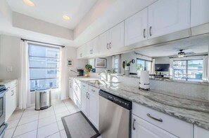 Fridge, microwave, oven, stovetop - Hidden Beach Retreat - Pool - Steps from the sand (Clearwater Beach)