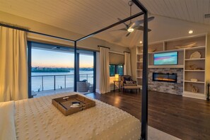 Relax in this serene retreat with a large bed, seating area, and fireplace.