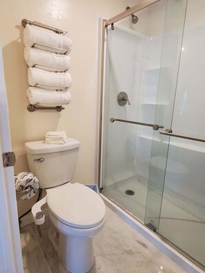 Shower, hair dryer, towels, soap