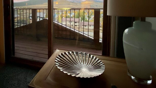 A room with a view of a mountainous landscape through a sliding door. - August Special, Great Rates! Locking bike storage! (Gunnison)