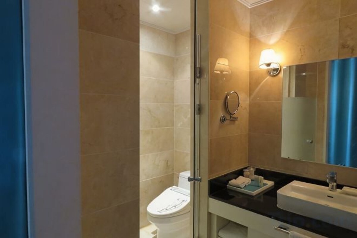Bathroom | Designer toiletries, hair dryer, bathrobes, slippers