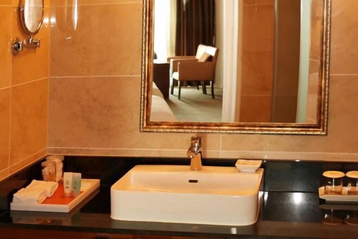 Designer toiletries, hair dryer, bathrobes, slippers