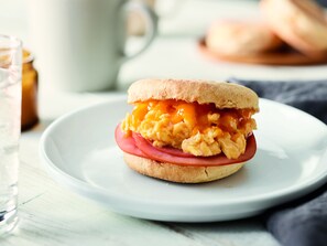 A breakfast sandwich on a white plate. -  Fairfield by Marriott Inn & Suites Knoxville Airport Alcoa (Alcoa)