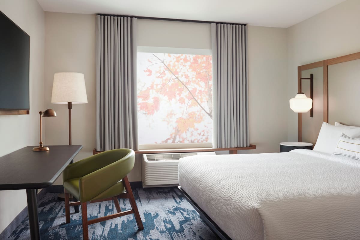 Down duvets, pillow-top beds, in-room safe, desk