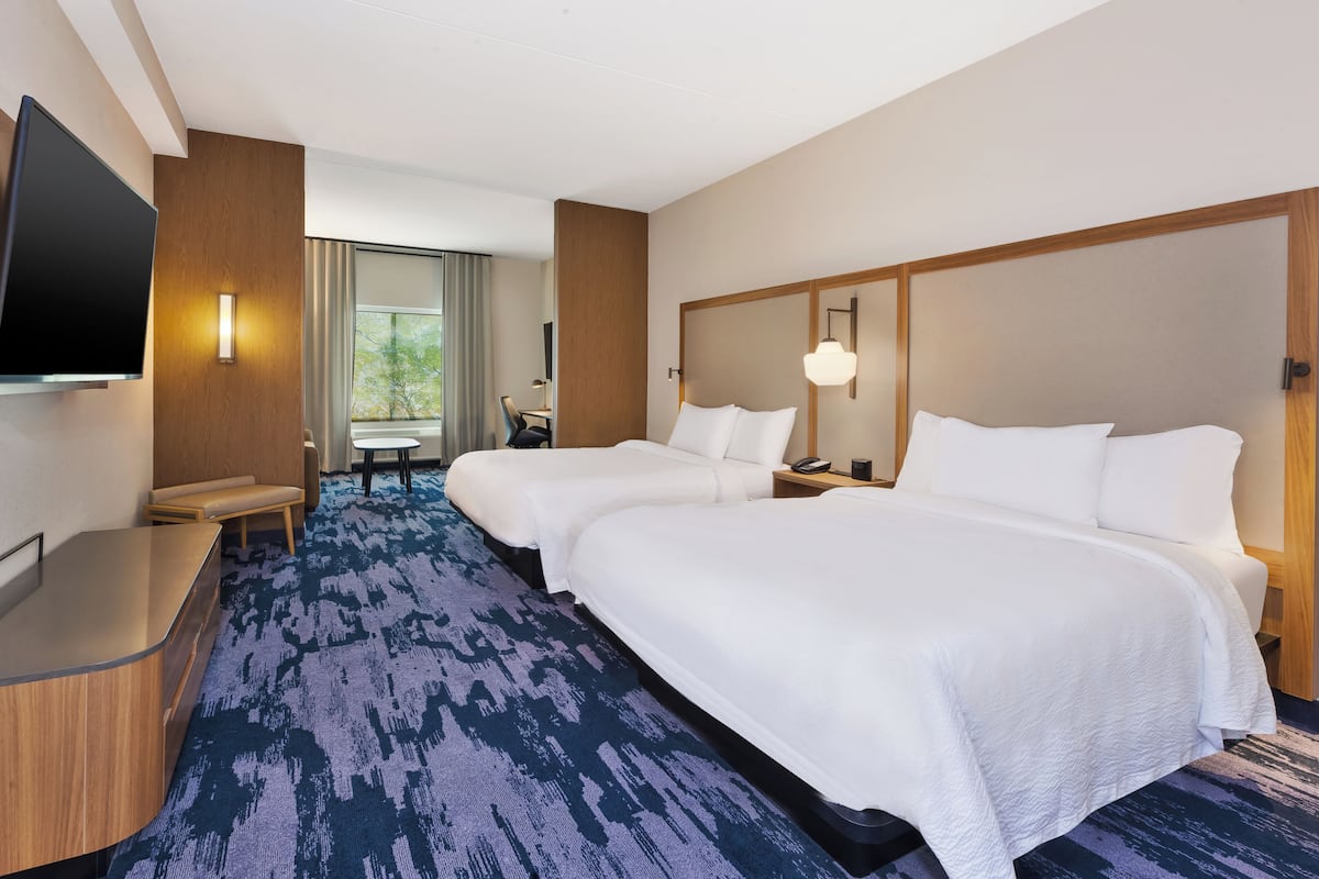 Down duvets, pillow-top beds, in-room safe, desk
