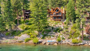 A lodge with a pool, surrounded by trees and a rocky hillside. - Gonowabie Lodge - Crystal Bay Lakefront - TLUXP (Crystal Bay)
