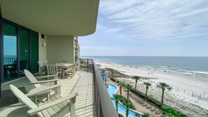 A balcony with a view of the beach and ocean. - Parking level!  Lazy river/Slide. New to the rental market!! (Orange Beach)