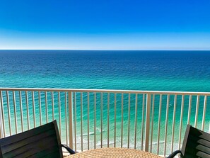 A balcony with a view of the ocean. - Beach-Front Condo, Remodeled Kitchen & Bath, Free Beach Chairs, Large Balcony (Panama City Beach)