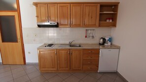 Fridge, stovetop, coffee/tea maker, cookware/dishes/utensils