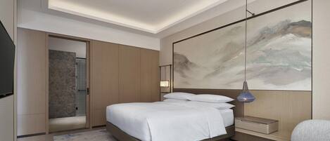 Une chambre d’hôtel moderne avec un grand lit, une table de chevet, une œuvre d’art accrochée au mur et un espace douche.