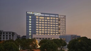 A modern hotel building with the name 'FOUR POINTS' prominently displayed. - Four Points by Sheraton Suzhou, Wuzhong (Suzhou)