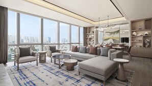 A modern living room with a sofa, armchairs, and a coffee table. - Four Points by Sheraton Suzhou, Wuzhong (Suzhou)