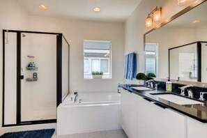 Combined shower/bathtub, hair dryer, towels, soap