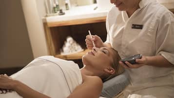 Experience a rejuvenating facial treatment in a serene spa setting, complete with a skilled practitioner and soothing ambiance.