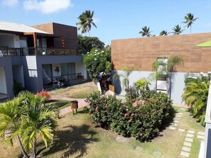 Enjoy a home away from home with a balcony overlooking a serene garden.