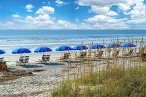 Guests can relax under the shade of our beach umbrellas and enjoy the ocean views.