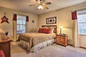 A bedroom with a bed, dresser, desk, and ceiling fan. - ‘Firefly Cove’ - 3 Mi to Parkway & National Park! (Sevierville)