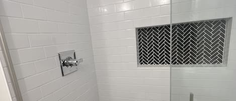 Combined shower/tub, hair dryer, towels, soap
