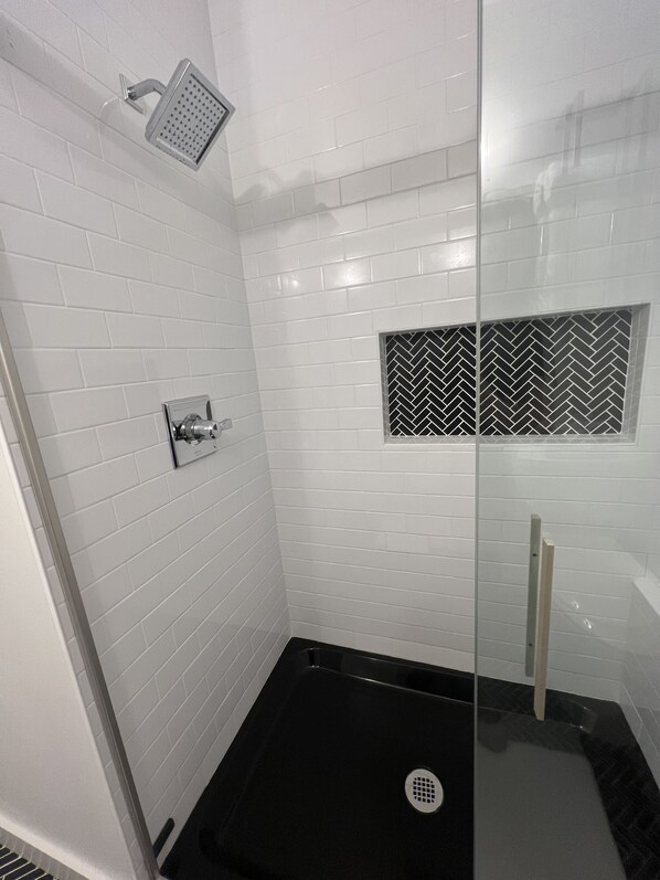 Combined shower/tub, hair dryer, towels, soap