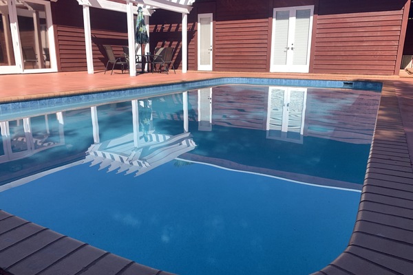 Grand pool: ~ 20x35’ surrounded by massive pool deck